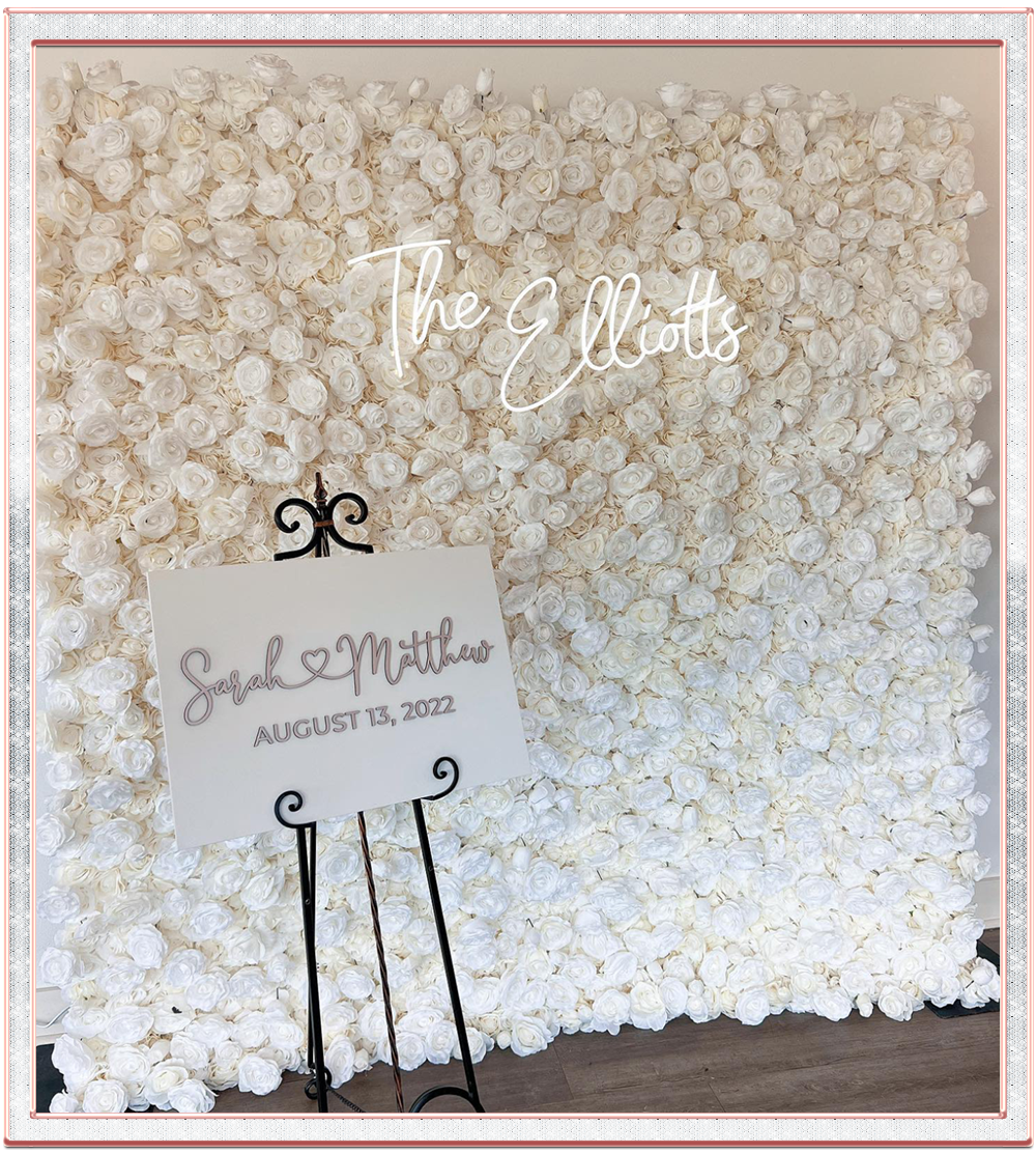 beautifil white flower wall with custom neon sign and custom acrylic sign